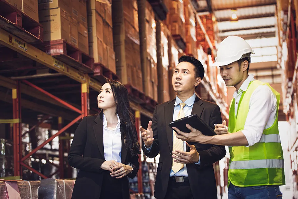 Inventory management professional conducting stock counting in a warehouse.