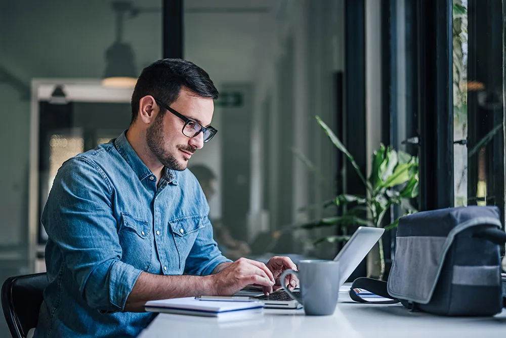 Financial expert reviewing reports and charts, symbolizing financial reporting in Dubai, UAE